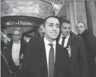  ?? AP PHOTO ?? Luigi Di Maio, the Italian 5-Star Movement’s leader, smiles as he leaves an hotel in Rome, Monday. With the anti-establishm­ent 5-Stars the highest vote-getter of any single party, the results confirmed the defeat of the two main political forces that...