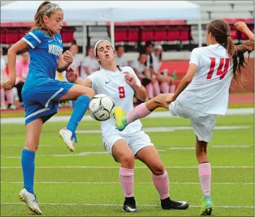  ?? DANA JENSEN/THE DAY ?? Waterford’s Olivia Davidson, left, and NFA’s Kayla Park (14) come into contact with the ball in the air with NFA’s Jillian Brunelli (9) caught in the middle during Monday’s girls’ soccer match in Norwich. NFA won 2-0.