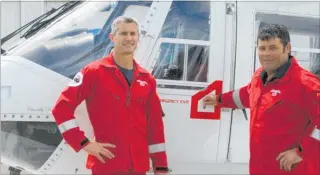  ?? PHOTO / SUPPLIED ?? Hawke’s Bay Rescue Helicopter pilots Jeremy Bruce (left) and Hamish Ramsay pictured in front of the white helicopter, on loan for the next month from Palmerston North.