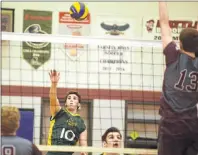  ?? JASON MALLOY/THE GUARDIAN ?? Ben MacDougall, a Grade 10 member of the Three Oaks Senior High Axemen’s volleyball team, hits a return Friday during the Prince Edward Island School Athletic Associatio­n senior AAA boys’ volleyball final at Colonel Gray High School.