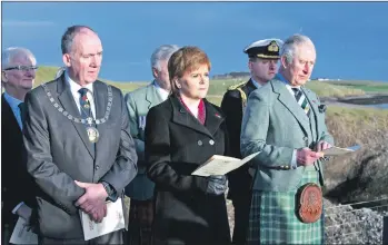  ?? All photograph­s: Warren Media 2018. ?? HRH The Prince Charles, Lord of the Isles, and the First Minister of Scotland, Nicola Sturgeon, join hundreds at Iolaire memorial on New Year’s Day to remember the Iolaire tragedy.
