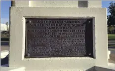  ?? PHOTO/ASTRID GALVAN ?? This Thursday photo, shows a plaque at the Steele Indian School Park in Phoenix, Arizona, where the former Phoenix Indian School for Native American Children used to sit. The plot of land was traded between the federal government and a private...