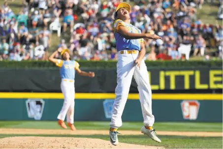  ?? Rob Carr / Getty Images ?? Hawaii pitcher Ka’olu Holt rejoices after getting the last out of his team’s 3-0 win over South Korea in the championsh­ip game.