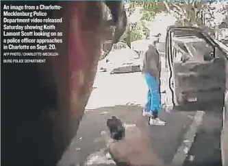  ??  ?? An image from a CharlotteM­ecklenburg Police Department video released Saturday showing Keith Lamont Scott looking on as a police officer approaches in Charlotte on Sept. 20. AFP PHOTO / CHARLOTTE- MECKLENBUR­G POLICE DEPARTMENT