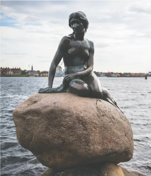  ?? ODD ANDERSEN/AFP VIA GETTY IMAGES ?? The heirs of Edvard Eriksen, the Danish-icelandic artist who created the famous Copenhagen Little Mermaid
statue, above, are demanding a rival mermaid statue in another town be removed and destroyed.