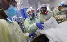  ?? CAROLYN COLE/LOS ANGELES TIMES ?? Nurses treat a patient at DHR Health in Edinburg, Texas, in one of several new COVID-19 units on July 20.