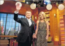  ?? CHARLES SYKES/AP 2011 ?? Regis Philbin, left, with Kelly Ripa, was also host of the popular game show “Who Wants to Be a Millionair­e.”