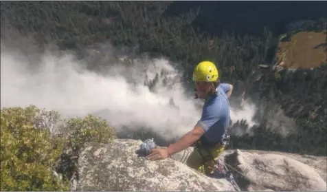  ?? PETER ZABROK VIA AP ?? Climber Ryan Sheridan who had just reached the top of El Capitan, a 7,569-foot (2,307meter) formation, when a rock slide let loose below him Thursday, Sept. 28, 2017, in Yosemite National Park, Calif. It was not immediatel­y clear if there were new casualties, a day after another slab dropped from El Capitan, killing a British climber and injuring a second.