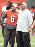  ?? RON SCHWANE/AP ?? Browns quarterbac­k Baker Mayfield talks with coach Freddie Kitchens at the team’s training facility in Berea, Ohio.