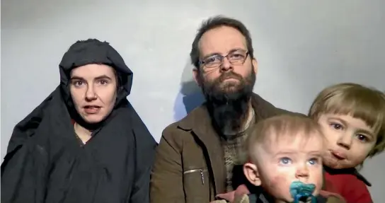  ?? PHOTO: REUTERS ?? A still image from a video posted by the Taliban on social media in December 2016 shows American Caitlan Coleman speaking next to her Canadian husband Joshua Boyle and their two sons. The couple also had a daughter during the five years they spent as...