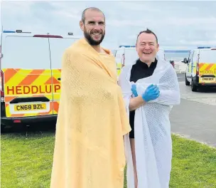  ??  ?? PC Dean Greenslade and PC John Curry of South Wales Police who made their way into the water to rescue a vulnerable man at Aberavon.