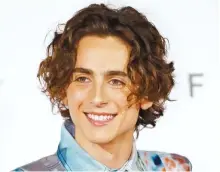  ?? Yonhap ?? Timothee Chalamet smiles at fans from the outdoor stage in front of Busan Cinema Center in the beachfront district of Haeundae, Busan, Tuesday before the screening of the film “The King.” He visited Korea for the 24th Busan Internatio­nal Film Festival.