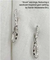  ?? ?? "Arum" earrings, featuring a seafoam-inspired gem setting, by Sarah Madeleine Bru.