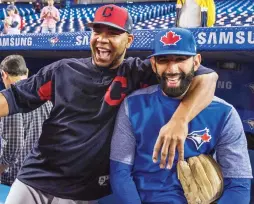  ?? (Reuters) ?? FORMER TEAMMATES Edwin Encarnacio­n (left) of the Cleveland Indians and the Toronto Blue Jays’ Jose Bautista share a laugh prior to Monday night’s game between their clubs, which the host Jays won 4-2. Before Encarnacio­n left as a free agent in the...