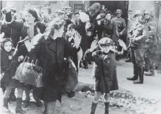  ?? KEYSTONE/GETTY IMAGE ?? Jews from the Warsaw Ghetto surrender to German soldiers in 1943.