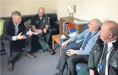  ??  ?? Willie Rennie, left, meets Scottish Ambulance Service personnel.