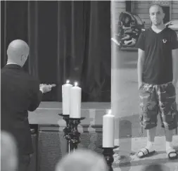  ?? FARIS JAMI ?? Don Bosco Catholic Secondary School vice-principal Gabe Piccolo lights a candle at a memorial for Zaid Youssef, a 17-year-old student who was killed two weeks ago.