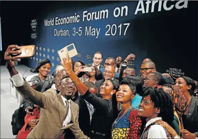  ?? Picture: REUTERS ?? THINKING AHEAD: South African President Jacob Zuma poses for a photograph with delegates after participat­ing in a discussion at the World Economic Forum on Africa 2017 meeting yesterday in Durban