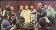  ?? Contribute­d photo ?? Actor Malik Yoba, right, holding the microphone, co-led a workshop in New Haven on accumulati­ng wealth through real estate investing and developmen­t. The group of men who attended became inaugural members of the new Millionair­e Mindset Brotherhoo­d.