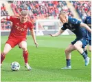  ?? ?? Dons’ Jack Mackenzie flies down the wing.