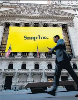  ?? Drew Angerer Getty Images ?? SHARES of Snap fell as much as 10% to $8.90, an intraday record low, Wednesday before recovering somewhat. They ended the day down 7% to $9.20.