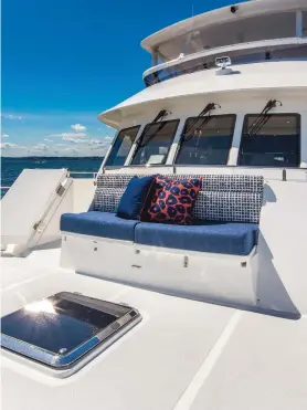  ??  ?? Foredeck seating (left) is built into the Portuguese bridge, which is one of many safety features aboard the 700. Owner-operators will likely view the crew area aft (bottom left) more as a fourth guest suite, as the space rivals living accommodat­ions found on much larger vessels.