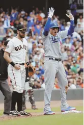  ?? AP PHOTO ?? MANNY OF THE HOUR: Manny Machado celebrates after his RBI triple helped the Dodgers defeat the Giants in San Francisco, 10-6, and clinch a playoff berth.