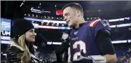  ?? ELISE AMENDOLA — THE ASSOCIATED PRESS FILE ?? Fox Sports television sideline broadcast reporter Erin Andrews, left, interviews then-new England Patriots quarterbac­k Tom Brady at midfield after an NFL football game between the Patriots and the New York Giants, Thursday, Oct. 10, 2019, in Foxborough, Mass.