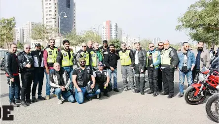  ??  ?? Above: A group picture of Bikers &amp; LoYAC volunteers before the ride. At right: Group photo of thesafety road captains