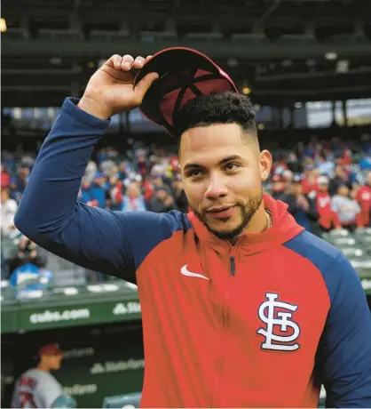  ?? ARMANDO L. SANCHEZ /CHICAGO TRIBUNE ?? Cardinals catcher Willson Contreras watches the video board as the Cubs play a clip honoring their former catcher before the game Monday at Wrigley Field.