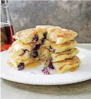  ?? AMERICA’S TEST KITCHEN/AP] [PHOTO BY CARL TREMBLAY, ?? This recipe for Blueberry Pancakes appears in the “Complete Cookbook for Young Chefs.”