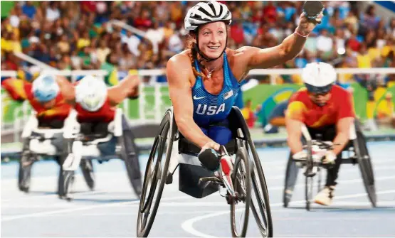  ??  ?? One in the bag: Tatyana McFadden celebrates after winning the women’s 400m T54 final in the Paralympic­s at the Olympic Stadium in Rio de Janeiro on Sept 11. — Reuters