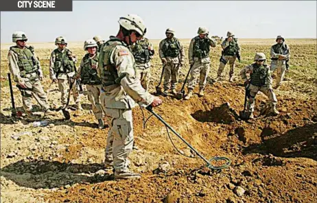  ??  ?? Soldiers looking for landmines in a war-torn zone in Korea
Source:blogs.wsj.com