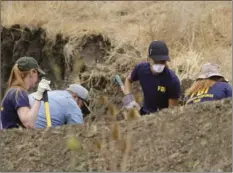  ?? DAVID MIDDLECAMP/THE TRIBUNE (OF SAN LUIS OBISPO ?? The FBI and San Luis Obispo County Sheriff’s Department continue their dig and investigat­ion on the hillside above Cal Poly related to the disappeara­nce of student Kristin Smart two decades ago, Thursday in San Luis Obispo.