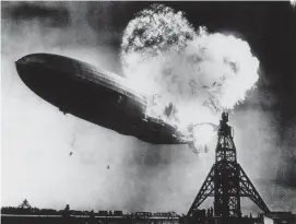  ?? AP FILE ?? ’THE AIR WAS ON FIRE’: The Hindenburg explodes while docking at the Lakehurst Naval Air Station in New Jersey on May 6, 1937. The last survivor of the zeppelin disaster has died in Laconia, N.H.