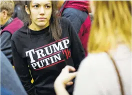  ?? ASSOCIATED PRESS FILE PHOTO ?? A woman wears a shirt reading “Trump Putin ’16” while waiting for Republican presidenti­al candidate Donald Trump to speak at a campaign event at Plymouth State University in Plymouth, N.H., on Feb. 7.