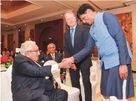 ?? PHOTO: PTI ?? Union Commerce and Industry Minister Piyush Goyal with former US secretary of state Henry Kissinger at the second annual India Leadership Summit in New Delhi on Monday