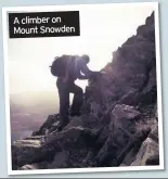  ??  ?? A climber on Mount Snowden