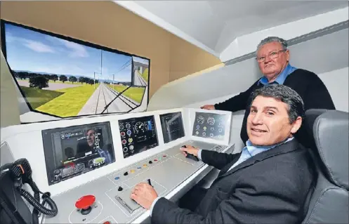  ??  ?? Training up: Auckland Transport chairman Lester Levy with driver trainer Pat James in one of the simulators being used to prepare drivers for the new electric trains, which are on their way from Spain.