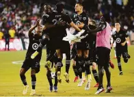  ?? Ashley Landis / Associated Press ?? MLS players celebrate FC Dallas forward Ricardo Pepi’s (24) winning goal in the MLS All-Star Game.