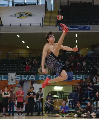  ?? Photo by Logan Hebel ?? NYO GAMES— Parker Kenick performs the One-Foot High Kick during last week’s NYO Games in Anchorage. He brought home gold in One-Hand Reach, silver in the Two-Foot High Kick and placed fourth in OneFoot High Kick.