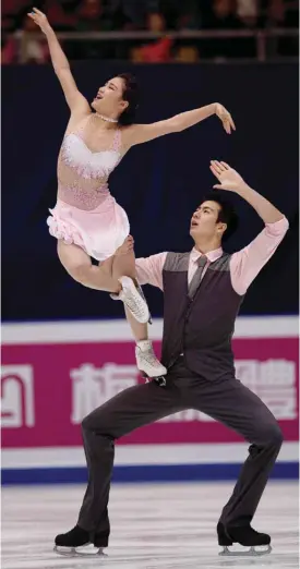  ?? — AFP ?? BEIJING: Shiyue Wang and Xinyu Liu of China perform during the ice dance free dance at the Ice Dance short dance at the Cup of China ISU Grand Prix of Figure Skating in Beijing yesterday.