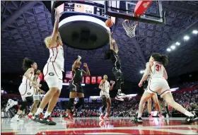  ?? AP PHOTO/ALEX SLITZ ?? South Carolina guard Zia Cooke, second from right, shoots over Georgia guard Audrey Warren, right, during the second half of an NCAA college basketball game in Athens, Ga., Monday, Jan. 2, 2023.