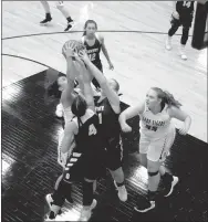  ?? MARK HUMPHREY ENTERPRISE-LEADER ?? Prairie Grove junior Jasmine Wynos, shown battling Gentry’s Randi Jo Bolinger (No. 4) and Emily Toland for control of the basketball last season as a sophomore, has yet to play this season. Prairie Grove missed her rebounding ability during a 55-32 loss at Pottsville on Dec. 3.
