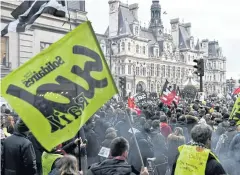  ?? AFP ?? Protesters demonstrat­e as part of a nationwide multi-sector strike against French government’s pensions overhaul near the city hall in Paris, France last week.