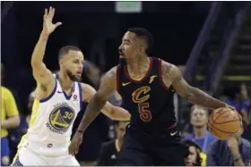  ?? MARCIO JOSE SANCHEZ — THE ASSOCIATED PRESS ?? J.R. Smith is defended by Warriors guard Stephen Curry during the first half May 31 in Oakland.