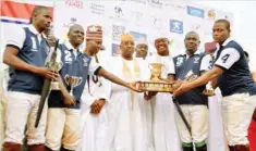  ??  ?? Players of EL-Amin team show off their 13th Georgian Cup during the Prize Presentati­on ceremony of the 2016 MTN Kaduna internatio­nal polo Tournament in Kaduna