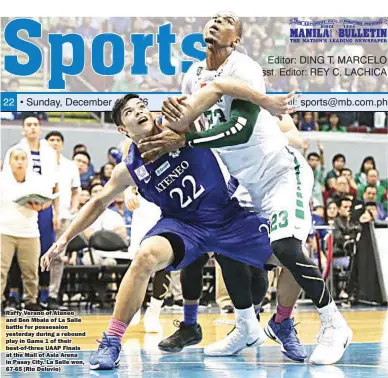  ??  ?? Raffy Verano of Ateneo and Ben Mbala of La Salle battle for possession yesterday during a rebound play in Game 1 of their best-of-three UAAP Finals at the Mall of Asia Arena in Pasay City. La Salle won, 67-65 (Rio Deluvio)