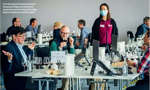  ?? ?? From left (seated): Northern & Eastern Europe joint Regional Chair Darrel Joseph discusses the wines with judges Wojciech Bońkowski and Elod Adam