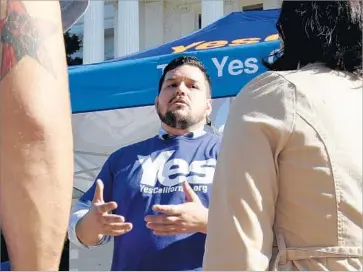  ?? Rich Pedroncell­i Associated Press ?? MARCUS RUIZ EVANS, center, has been involved in California secessioni­st causes since 2012 and calls himself the founder of the “Calexit” movement. Here he answers questions in Sacramento last November.